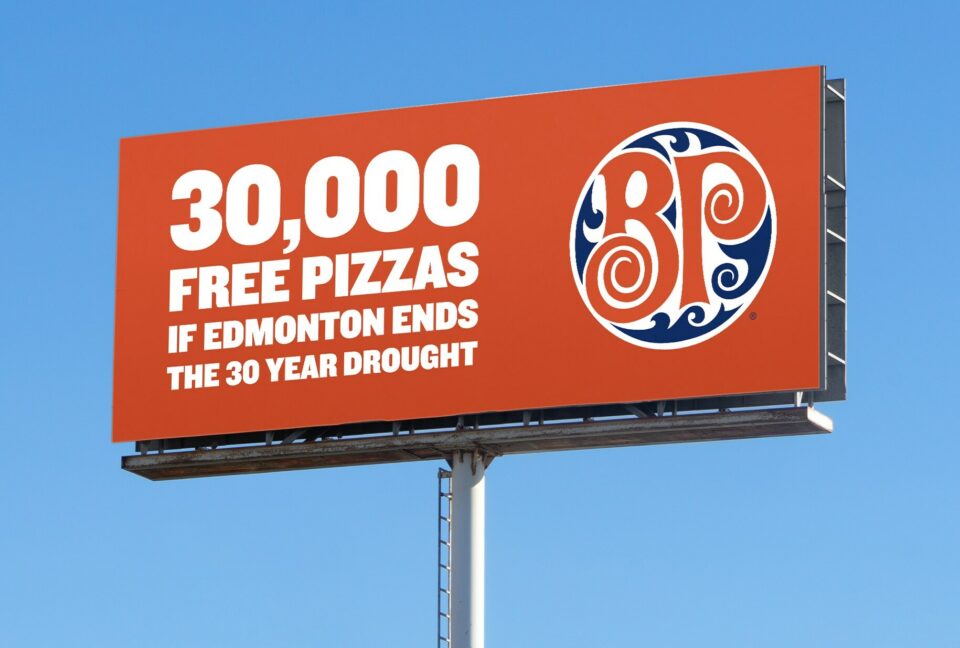 Boston Pizza highway sign saying 30,000 free pizzas if Edmonton ends the 30-year drought