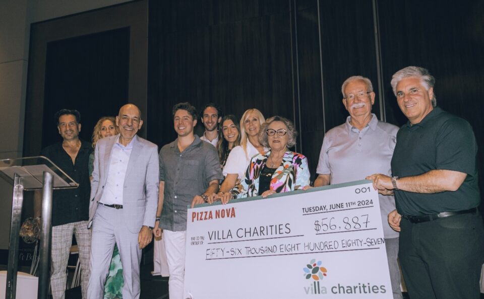 The Primucci Family presents a cheque in the amount of $56,887 to Villa Charities. Marco DeVouno, President and Chief Executive Officer, Villa Charities accepts the donation on June 11, 2024. From left to right: Michael Primucci, Lori Primucci, Domenic Primucci, president of Pizza Nova, Samuel Primucci, Lucas Primucci, Mara Primucci, Anna Primucci, Gemma Primucci, Sam Primucci, CEO & Founder of Pizza Nova, Marco DeVuono, president & CEO of Villa Charities.