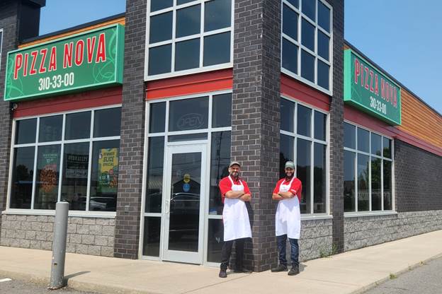 Pizza Nova’s Belleville location at 94 College St W will host a Customer Appreciation Event on September 14 from 11:00 am to 4:00 pm, with proceeds going to the Children’s Safety Village. From left to right: Zia, Franchisee, Pizza Nova and Shahab, Store Manager, Pizza Nova.