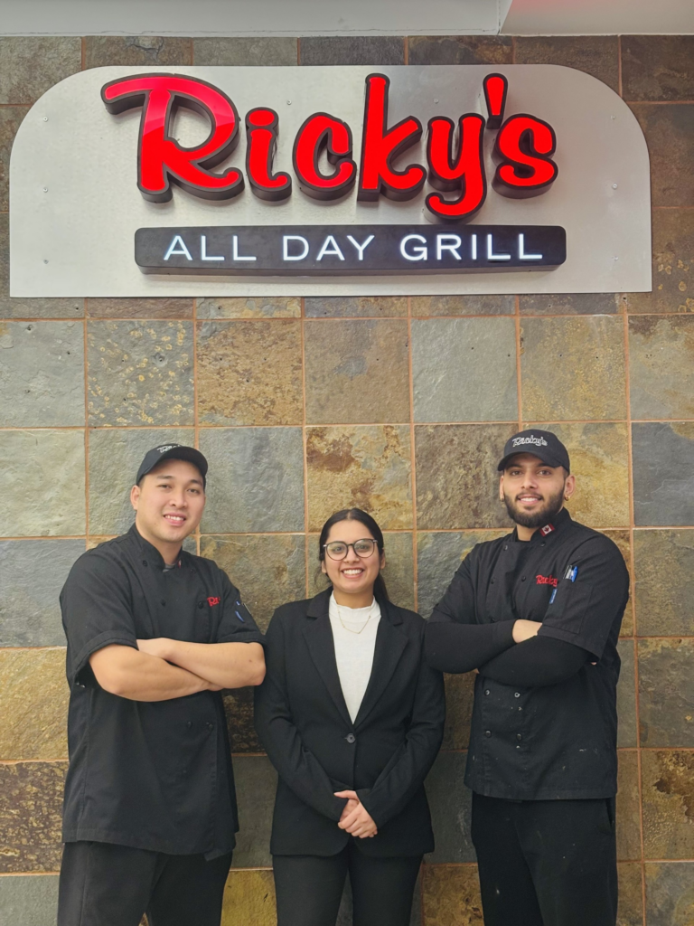 Satwant "Sweet" Kaur (centre), pictured with two chefs of the new Yellowknife 