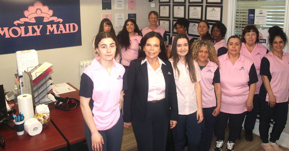 MOLLY MAID employees and owner in MOLLY MAID office