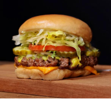 Fatburger Burger in a wooden table with a black background